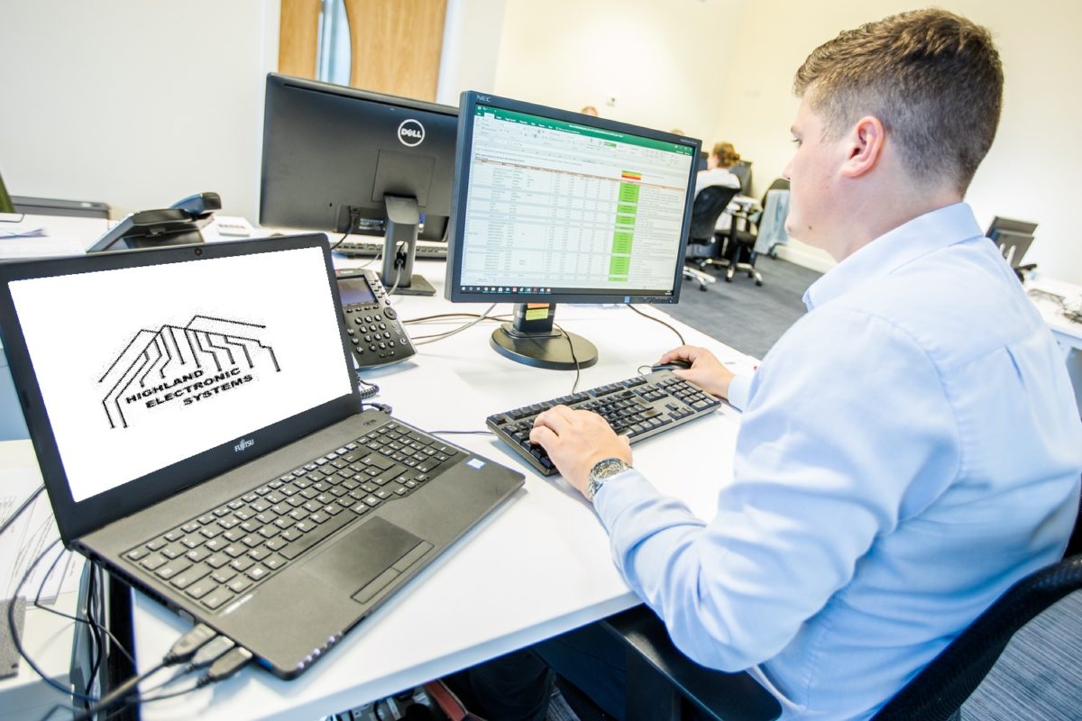 Highland Electronic Systems team member at a customer support workstation